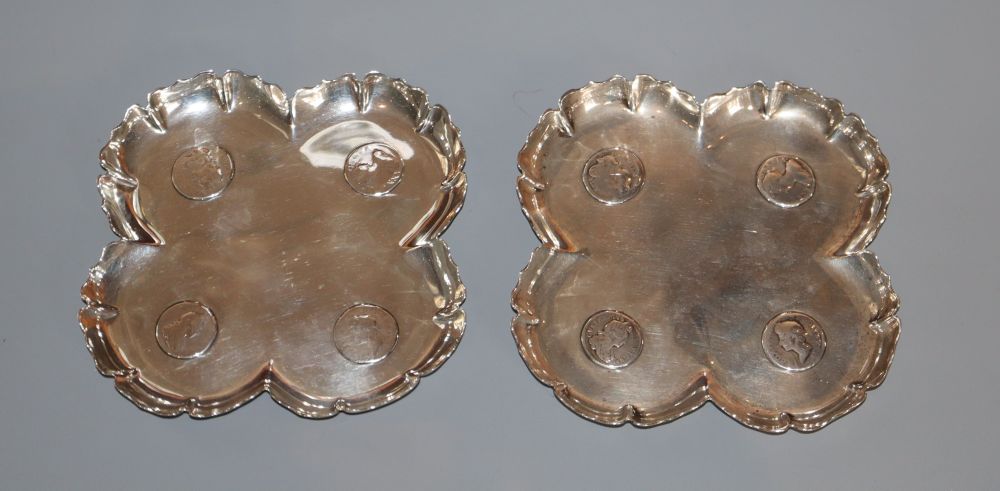 A pair of Victorian silver coin inset quatrefoil dishes, F.B. Thomas & Co, London, 1888, 11cm, gross 5.5 oz.